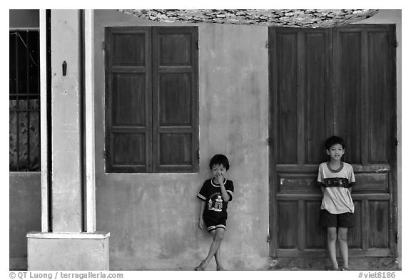 Children in front of old house, Hoi An. Hoi An, Vietnam (black and white)
