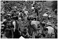 Colorful crowd at the sunday market, where people from the surrounding hamlets gather weekly to meet, shop and eat. Bac Ha, Vietnam ( black and white)