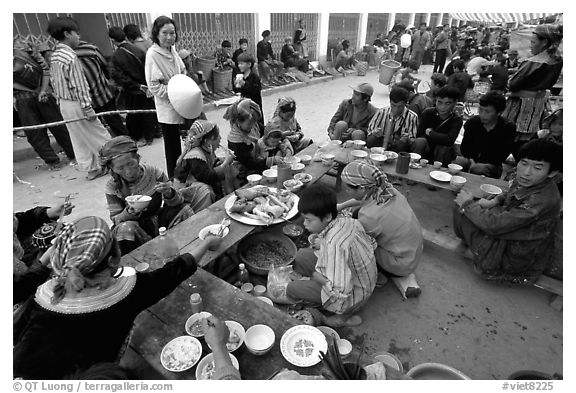 Festing on unusual foods, sunday market. Bac Ha, Vietnam (black and white)