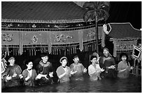 Artists salute after a water puppets performance in 1999. Hanoi, Vietnam ( black and white)