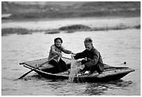Elderly couple fishing, Ken Ga canal. Ninh Binh,  Vietnam ( black and white)