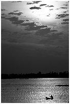 Small boat at sunrise. Chau Doc, Vietnam (black and white)