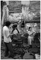 Hairdressing in the street. Ho Chi Minh City, Vietnam ( black and white)