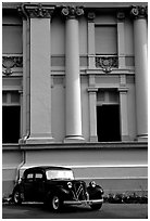 Classic Citroen car in front of city museum. Ho Chi Minh City, Vietnam (black and white)