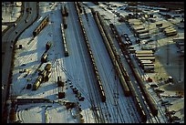 Rail tracks and cargo cars in winter. Calgary, Alberta, Canada