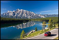 Car on the road besides Two Jack Lake. Banff National Park, Canadian Rockies, Alberta, Canada