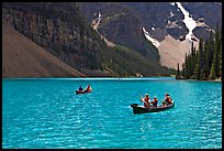 Canoes on the robbin egg blue Moraine Lake, afternoon. Banff National Park, Canadian Rockies, Alberta, Canada ( color)