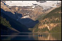 Rowers on Lake Louise, below Victoria Glacier, early morning. Banff National Park, Canadian Rockies, Alberta, Canada (color)