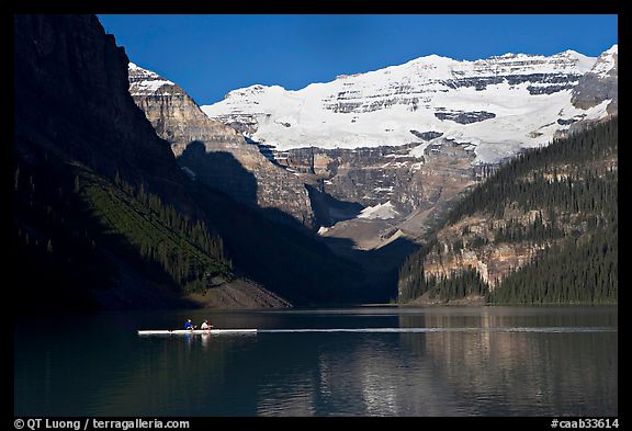 Rower, Lake Louise, and Victoria Peak, early morning. Banff National Park, Canadian Rockies, Alberta, Canada