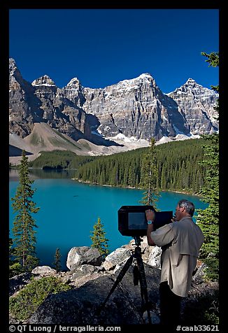 Photographer operating a 8x10 view camera at Moraine Lake. Banff National Park, Canadian Rockies, Alberta, Canada