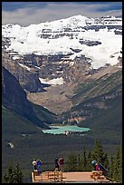 Tourists at observation platform, looking at  Lake Louise and  Victoria Peak. Banff National Park, Canadian Rockies, Alberta, Canada ( color)