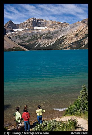 Family standing on the shores of Bow Lake. Banff National Park, Canadian Rockies, Alberta, Canada