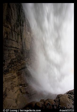 Curtain of water of Panther Falls, seen from behind. Banff National Park, Canadian Rockies, Alberta, Canada