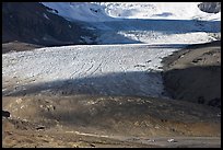 Base of Athabasca Glacier with cars parked on lot. Jasper National Park, Canadian Rockies, Alberta, Canada ( color)
