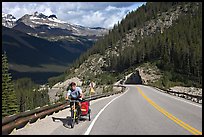 Cyclist with tow, Icefieds Parkway. Jasper National Park, Canadian Rockies, Alberta, Canada ( color)