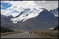 Cyclists on the Icefields Parkway at the base of Mt Athabasca. Jasper National Park, Canadian Rockies, Alberta, Canada (color)