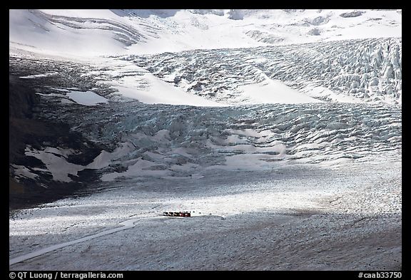 Distant view of snowcoaches parked at the base of the lower icefall on the Athabasca Glacier. Jasper National Park, Canadian Rockies, Alberta, Canada
