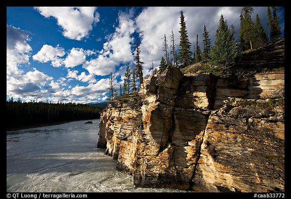 Cliff and Athabasca River, late afternoon. Jasper National Park, Canadian Rockies, Alberta, Canada (color)