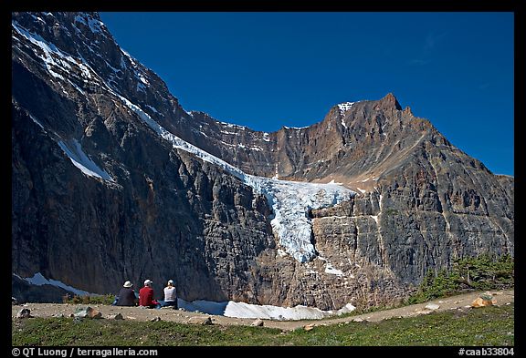 Hikers look at Angel Glacier, late morning. Jasper National Park, Canadian Rockies, Alberta, Canada (color)