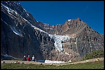 Hikers look at Angel Glacier, late morning. Jasper National Park, Canadian Rockies, Alberta, Canada (color)