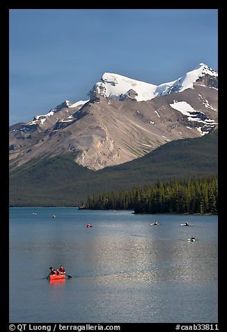 Red canoe on Maligne Lake, afternoon. Jasper National Park, Canadian Rockies, Alberta, Canada (color)