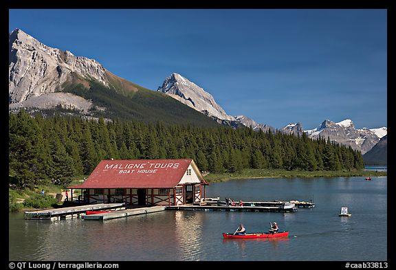 Boat house and canoe beneath Leh and Samson Peaks,  Maligne Lake. Jasper National Park, Canadian Rockies, Alberta, Canada