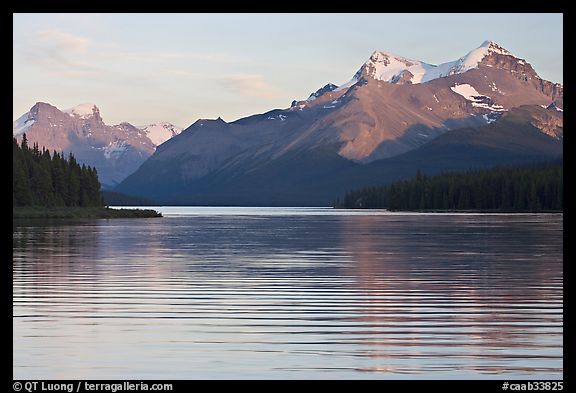 Peaks reflected in rippled water, Maligne Lake, sunset. Jasper National Park, Canadian Rockies, Alberta, Canada