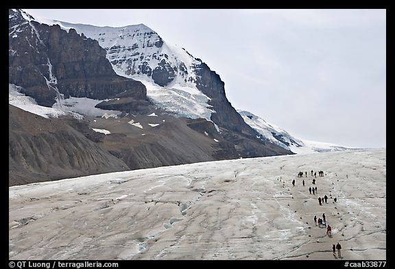Toe of Athabasca Glacier with tourists in delimited area. Jasper National Park, Canadian Rockies, Alberta, Canada (color)