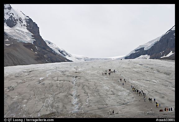 Toe of Athabasca Glacier with tourists in delimited area. Jasper National Park, Canadian Rockies, Alberta, Canada (color)