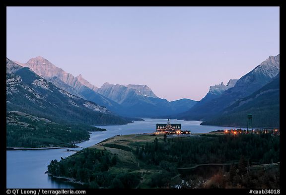 Prince of Wales hotel over Waterton Lakes, dusk. Waterton Lakes National Park, Alberta, Canada