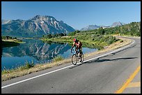 Cyclist next to Lower Waterton Lake. Waterton Lakes National Park, Alberta, Canada