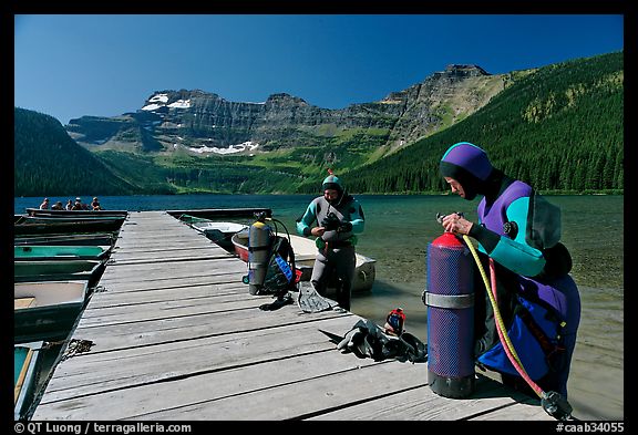 Scuba divers getting ready to dive, Cameron Lake. Waterton Lakes National Park, Alberta, Canada (color)