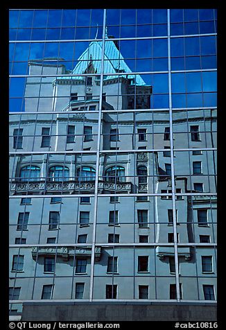 Buildings reflected in the glass windows of a high-rise buildings. Vancouver, British Columbia, Canada