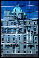 Buildings reflected in the glass windows of a high-rise buildings. Vancouver, British Columbia, Canada