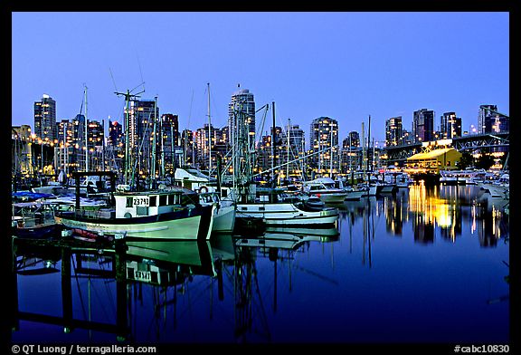 Fishing boats and skyline at night. Vancouver, British Columbia, Canada
