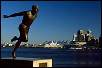 Runner's statue and Harbor center, late afernoon. Vancouver, British Columbia, Canada