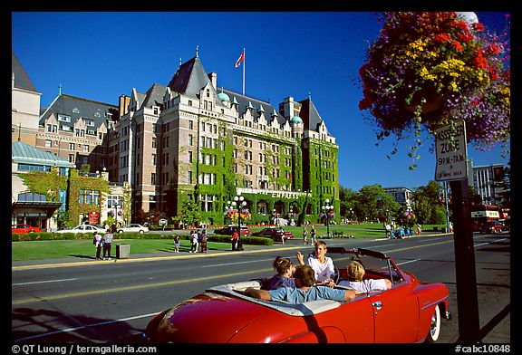 Red convertible car and Empress hotel. Victoria, British Columbia, Canada