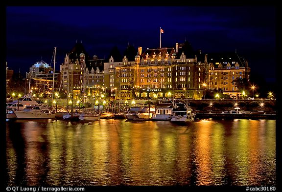 Empress hotel reflected in the Inner Harbour a night. Victoria, British Columbia, Canada (color)