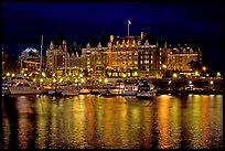 Empress hotel reflected in the Inner Harbour a night. Victoria, British Columbia, Canada ( color)