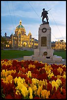Flowers, memorial, and illuminated parliament. Victoria, British Columbia, Canada ( color)