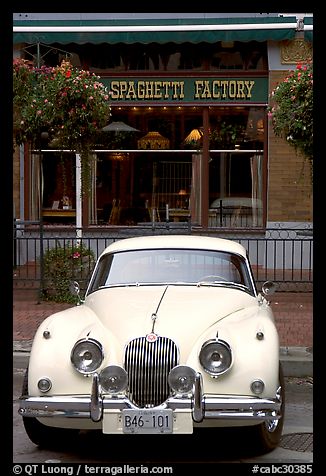 Classic car in front of Spaghetti Factory restaurant. Vancouver, British Columbia, Canada
