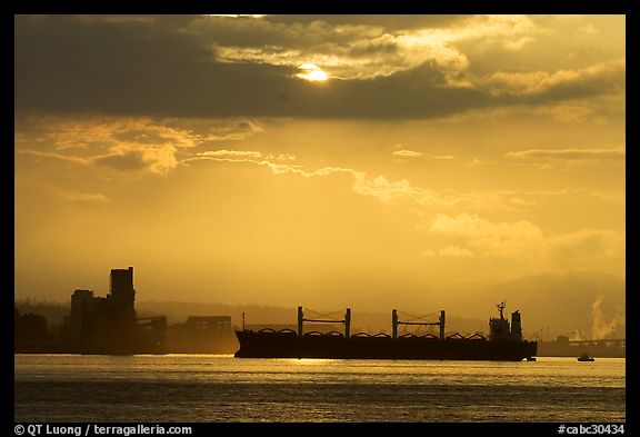Cargo ship in harbor a sunrise. Vancouver, British Columbia, Canada