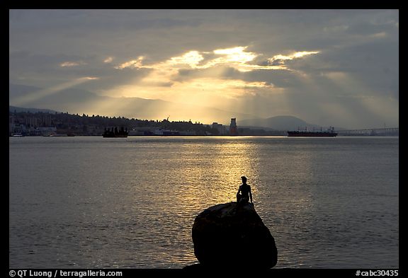 Girl in wetsuit statue, sunrise, Stanley Park. Vancouver, British Columbia, Canada