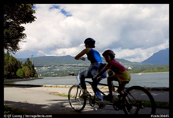 Tandem bicyclist on the trail around Stanley Park. Vancouver, British Columbia, Canada (color)