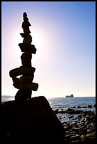 Backlit balanced rocks and ship in the distance. Vancouver, British Columbia, Canada ( color)