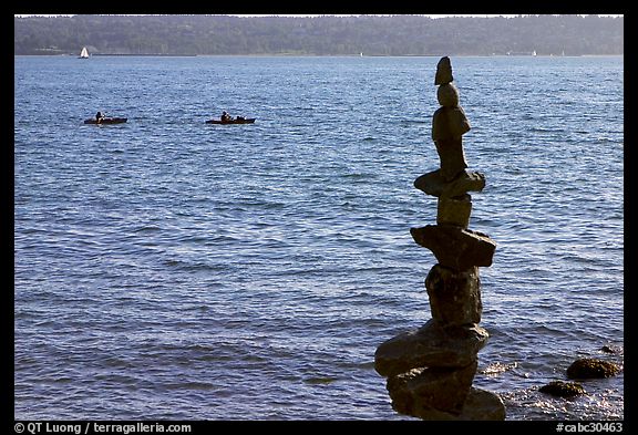 Balanced rocks and kayaks in a distance. Vancouver, British Columbia, Canada
