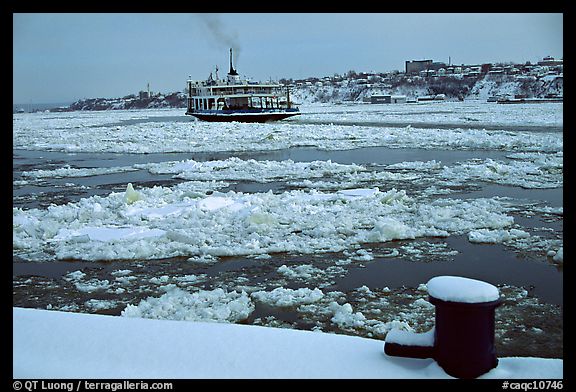 Ferry crossing the Saint Laurent river partly covered with ice, Quebec City. Quebec, Canada