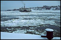 Ferry crossing the Saint Laurent river partly covered with ice, Quebec City. Quebec, Canada (color)