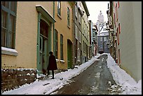 Narrow street partly covered with snow, Quebec City. Quebec, Canada