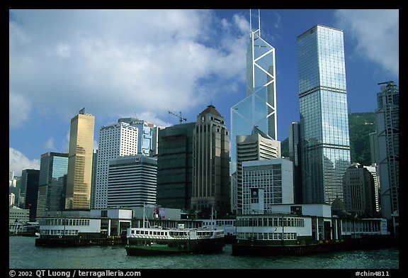 Star ferry leaves Hong-Kong island. Symmetrical shape alleviates need for turning around. Hong-Kong, China (color)
